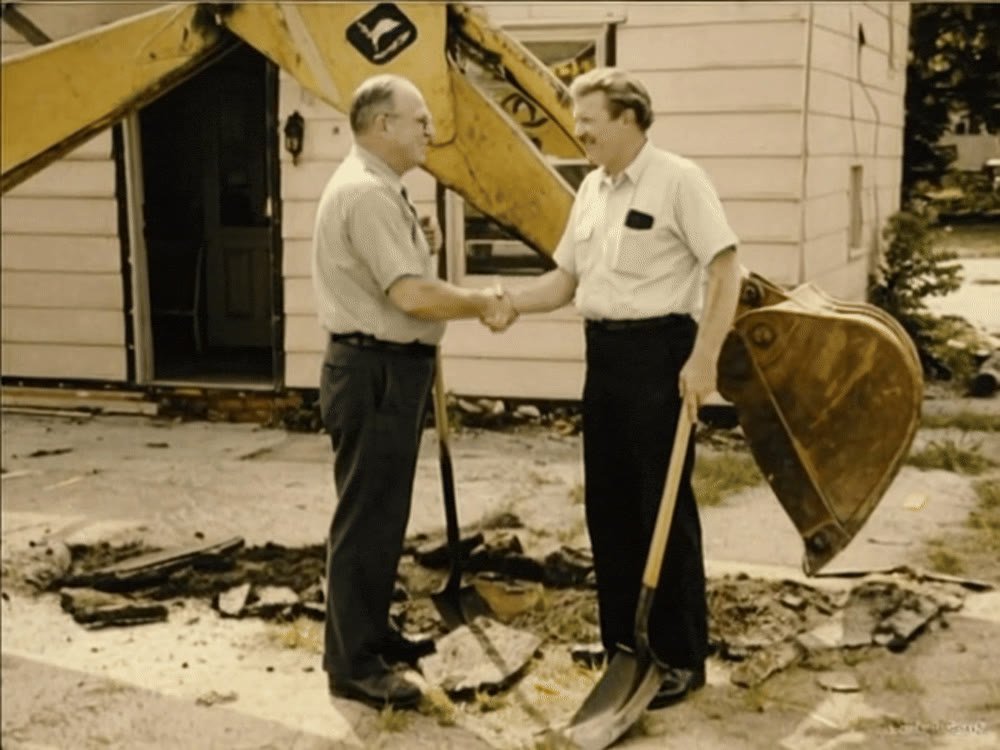 Founders Robert Cantrell and Carl Barnes shaking hands
